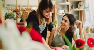 happy women working in floral shop