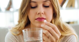 woman pill hand