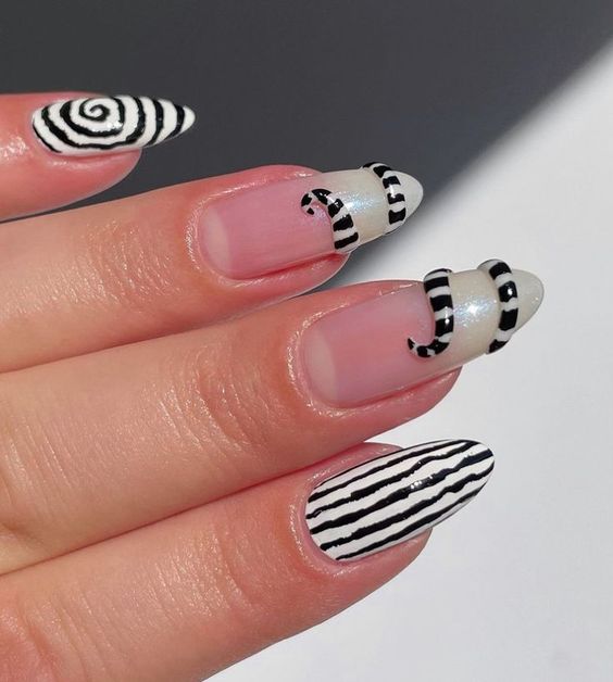 1727892525 633 Desenhos de unhas estilo Beetlejuice para inaugurar o Halloween