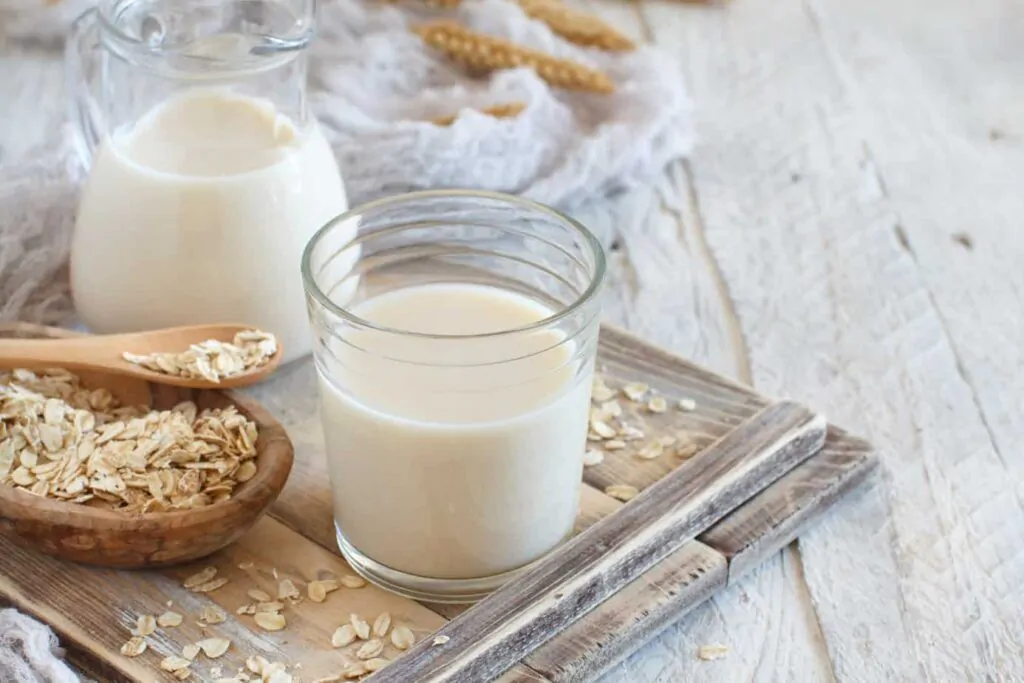 Vegan oat milk, non dairy alternative milk in a glass